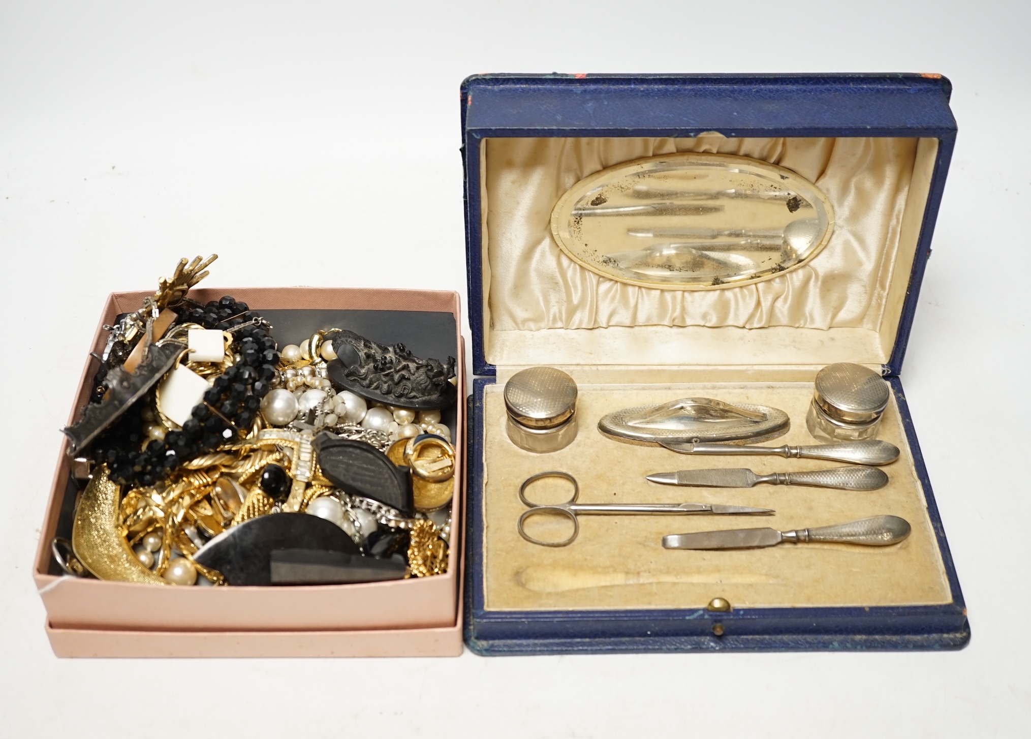 A collection of Victorian and later costume jewellery and a cased silver mounted vanity set. Condition - poor to fair to good